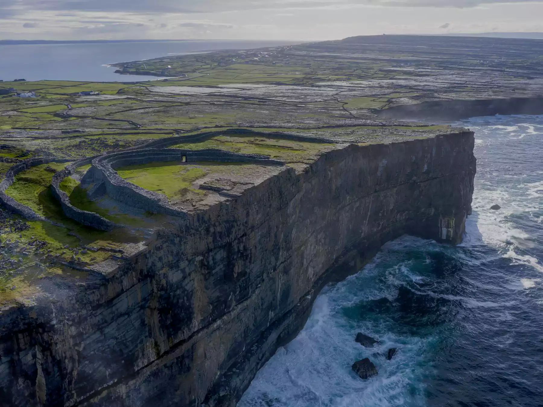 Dun Aonghasa over stormy seas on Inishmore, Aran Islands