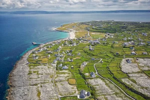Aerial view of houses dotted across the Aran Islands surrounded by ancient stone walls