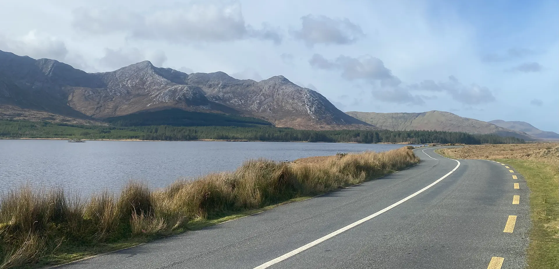 Road, Connemara National Park, Co Galway_master copy Mountains flanking a lake en route to Connemara National Park with Wild Atlantic Way Day Tours